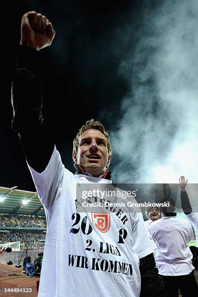 Head coach Markus Weinzierl of Regensburg celebrates after the Second Bundesliga relegation match between Karlsruher SC and Jahn Regensburg at...