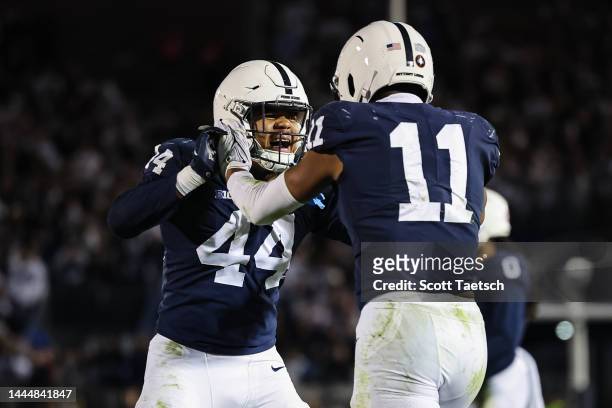 Abdul Carter of the Penn State Nittany Lions celebrates with Chop Robinson after recording a sack against the Michigan State Spartans during the...