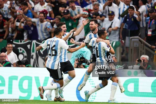 Lionel Messi of Argentina celebrates with teammates after scoring a goal during the FIFA World Cup Qatar 2022 Group C match between Argentina and...