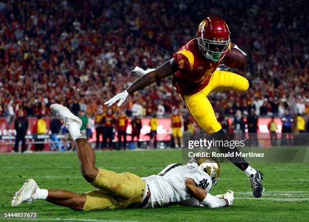 Mario Williams of the USC Trojans runs the ball against Jaden Mickey of the Notre Dame Fighting Irish in the second half at United Airlines Field at...