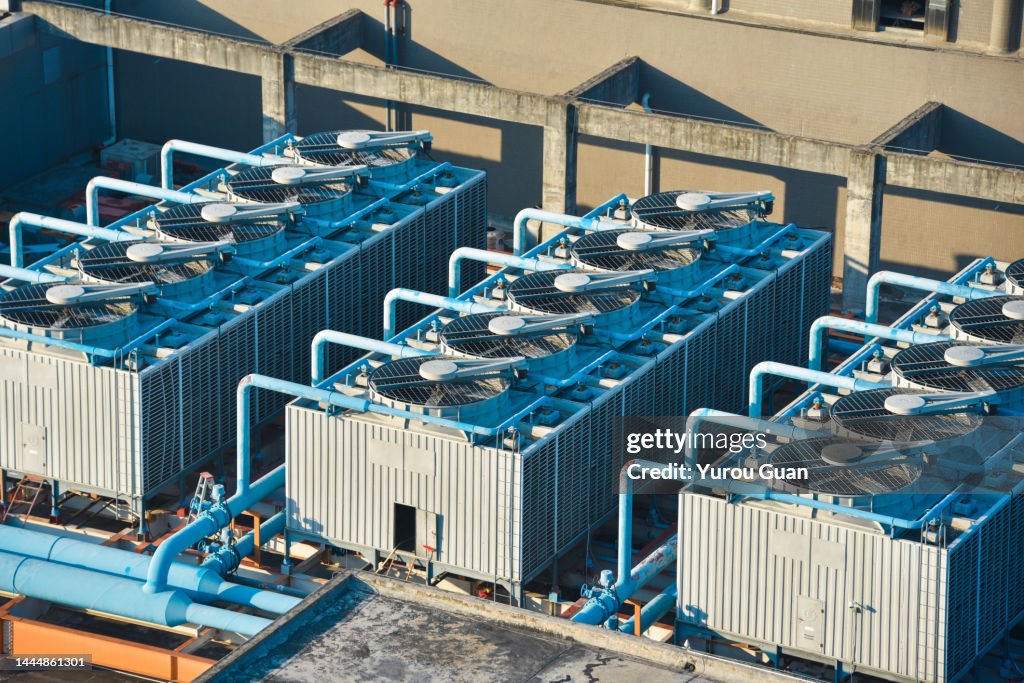 Cooling tower on roof top of building. Industrial air cooling system. Air chiller. Unit of air conditioner.