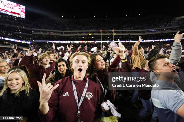 Fans rush the field following a Texas A&M Aggies win over LSU Tigers 38-23 during the second half at Kyle Field on November 26, 2022 in College...