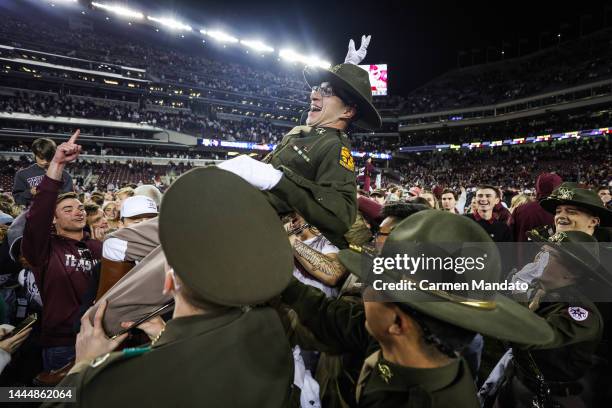 Fans rush the field following a Texas A&M Aggies win over LSU Tigers 38-23 during the second half at Kyle Field on November 26, 2022 in College...