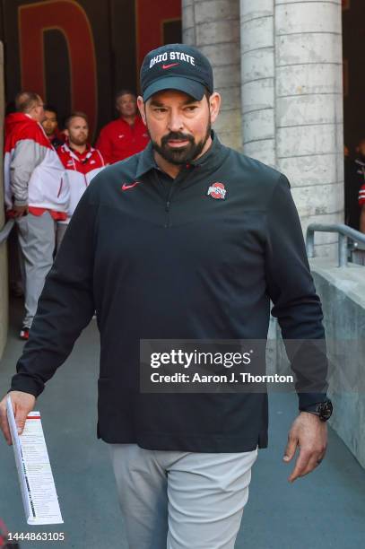 Head Football Coach Ryan Day of the Ohio State Buckeyes walks onto the field before a college football game against the Michigan Wolverines at Ohio...