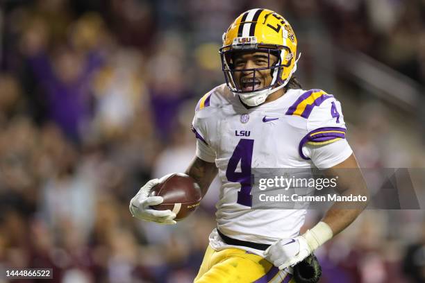 John Emery Jr. #4 of the LSU Tigers celebrates a touchdown during the second half against the Texas A&M Aggies at Kyle Field on November 26, 2022 in...