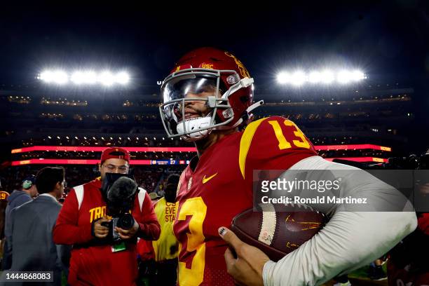 Caleb Williams of the USC Trojans carries the game football after defeating the Notre Dame Fighting Irish at United Airlines Field at the Los Angeles...