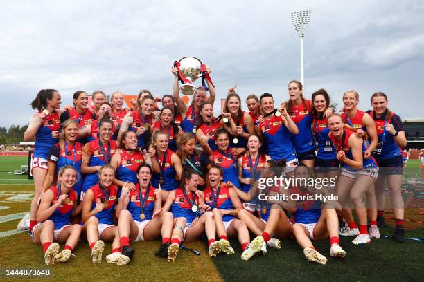 Demons celebraye winning the AFLW Grand Final match between the Brisbane Lions and the Melbourne Demons at Brighton Homes Arena on November 27, 2022...