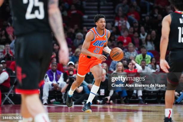 Aaron Wiggins of the Oklahoma City Thunder dribbles the ball during the game against the Houston Rockets at Toyota Center on November 26, 2022 in...