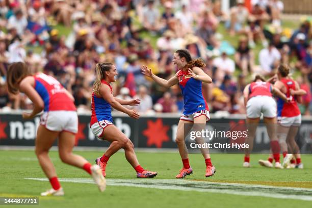 Demons celebrate winning the AFLW Grand Final match between the Brisbane Lions and the Melbourne Demons at Brighton Homes Arena on November 27, 2022...