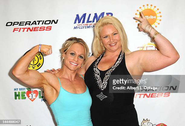 Body builder Dallas Malloy and personality Robin Coleman participate in The Operation Fitness Free Health & Fitness Expo held at Westfield Culver...