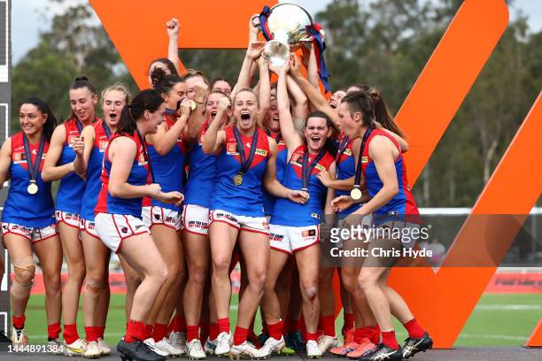 Demons celebrate winning the AFLW Grand Final match between the Brisbane Lions and the Melbourne Demons at Brighton Homes Arena on November 27, 2022...