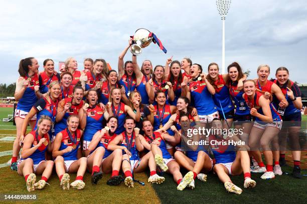 Demons celebrate winning the AFLW Grand Final match between the Brisbane Lions and the Melbourne Demons at Brighton Homes Arena on November 27, 2022...