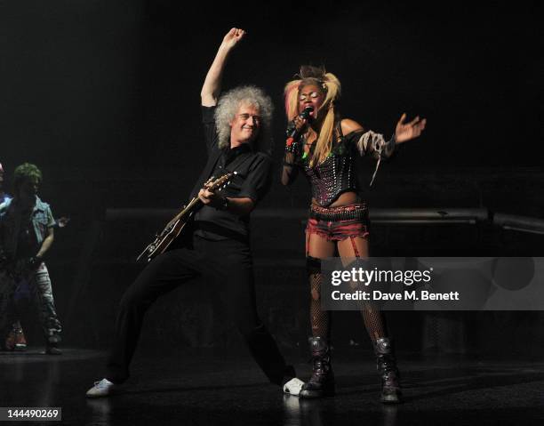 Queen musician Brian May and cast member Rachel John perform during the We Will Rock You 10 Year Anniversary Celebration performance at The Dominion...