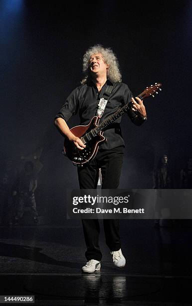 Queen musician Brian May performs during the We Will Rock You 10 Year Anniversary Celebration performance at The Dominion Theatre on May 14, 2012 in...