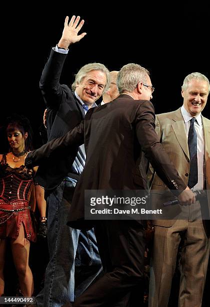 Robert De Niro, Ben Elton and Phil McIntyre bow at the curtain call during the We Will Rock You 10 Year Anniversary Celebration performance at The...