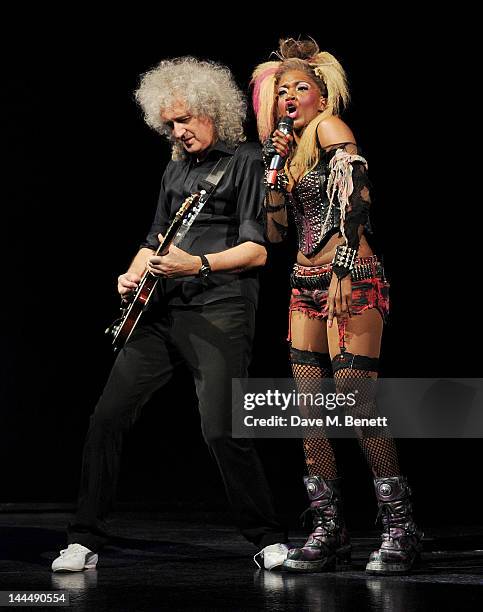 Queen guitarist Brian May and cast member Rachel John perform during the We Will Rock You 10 Year Anniversary Celebration performance at The Dominion...