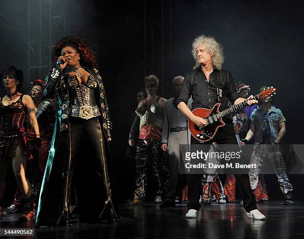 Cast member Brenda Edwards and Queen guitarist Brian May perform during the We Will Rock You 10 Year Anniversary Celebration performance at The...