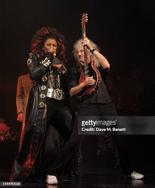Cast member Brenda Edwards and Queen musician Brian May perform at the curtain call during the We Will Rock You 10 Year Anniversary Celebration...