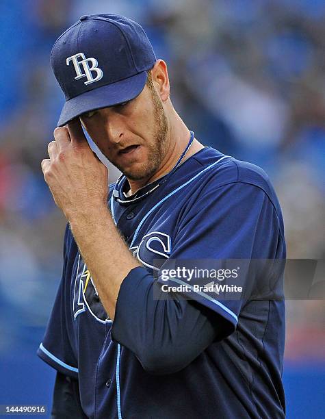 Jeff Niemann of the Tampa Bay Rays leaves the game at the start of the second inning after being hit with a ball during MLB game action the Toronto...