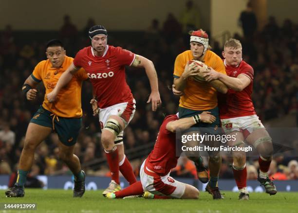 Fraser McReight of Australia is tackled by Jac Morgan of Wales during the Autumn International match between Wales and Australia at Principality...