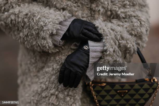 Sonia Lyson is seen wearing Gucci black leather gloves, Prada triangle green bag and Monki grey fluffy jacket, on November 23, 2022 in Berlin,...