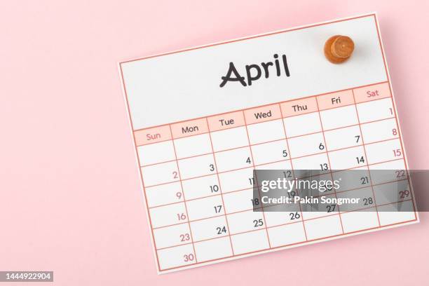 calendar desk 2023: april is the month for the organizer to plan and deadline with a push pin on paper background. - april stock pictures, royalty-free photos & images