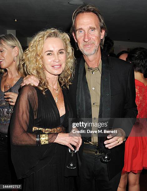 Angie Rutherford and Mike Rutherford celebrate backstage after the We Will Rock You 10 Year Anniversary performance at The Dominion Theatre on May...