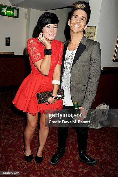 Russell Kane and guest celebrate backstage after the We Will Rock You 10 Year Anniversary performance at The Dominion Theatre on May 14, 2012 in...