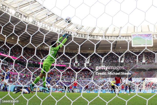 Keysher Fuller of Costa Rica scores their team's first goal past Shuichi Gonda of Japan during the FIFA World Cup Qatar 2022 Group E match between...