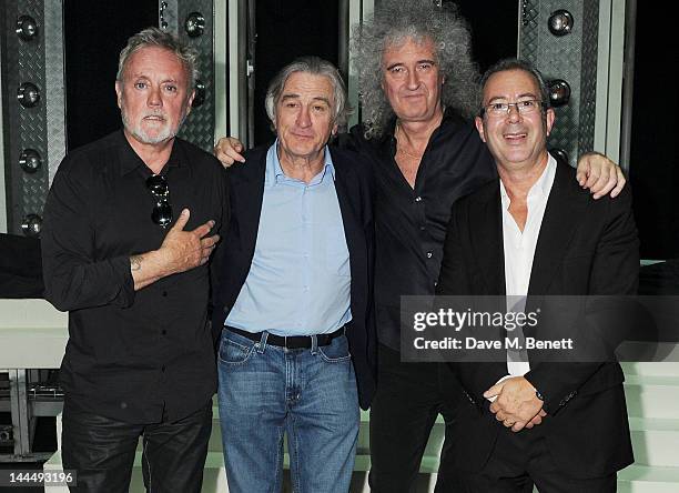 Roger Taylor, Robert De Niro, Brian May and Ben Elton celebrate backstage after the We Will Rock You 10 Year Anniversary performance at The Dominion...