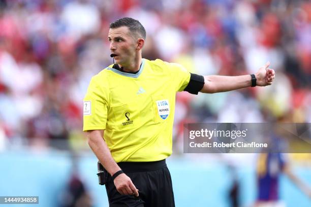 Referee Michael Oliver gestures during the FIFA World Cup Qatar 2022 Group E match between Japan and Costa Rica at Ahmad Bin Ali Stadium on November...