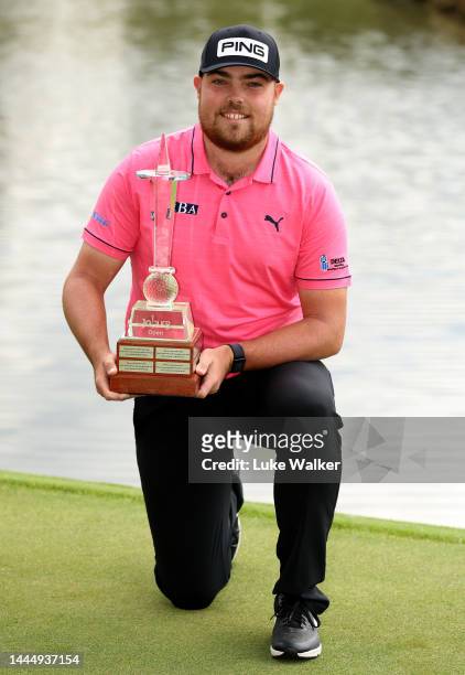 Dan Bradbury of England celebrates with the winners trophy after the final round of the Joburg Open at Houghton GC on November 27, 2022 in...