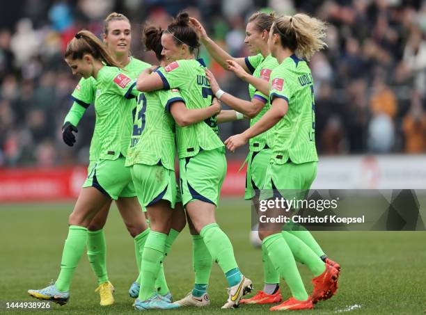 Marina Hegerin of Wolfsburg celebrates the third goal with her team mates during the FLYERALRM Frauen-Bundesliga match between 1. FC Koeln and VfL...