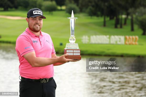 Dan Bradbury of England celebrates with the winners trophy after Day Four of the Joburg Open at Houghton GC on November 27, 2022 in Johannesburg,...