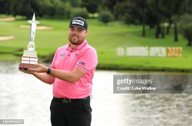 Dan Bradbury of England celebrates with the winners trophy after Day Four of the Joburg Open at Houghton GC on November 27, 2022 in Johannesburg,...