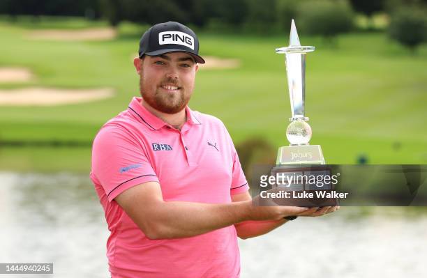 Dan Bradbury of England celebrates with the winners trophy after Day Four of the Joburg Open at Houghton GC on November 27, 2022 in Johannesburg,...