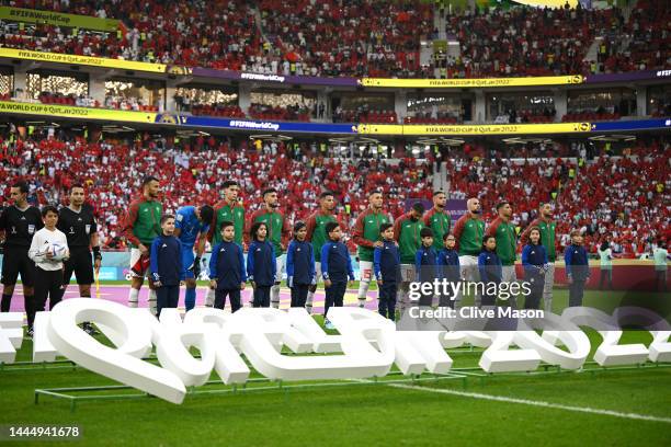 Morocco players line up for the national anthem prior to the FIFA World Cup Qatar 2022 Group F match between Belgium and Morocco at Al Thumama...