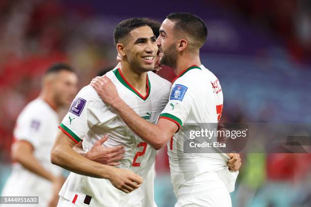 Hakim Ziyech of Morocco celebrates scoring his side's first goal later ruled offside with their teammate Achraf Hakimi the FIFA World Cup Qatar 2022...