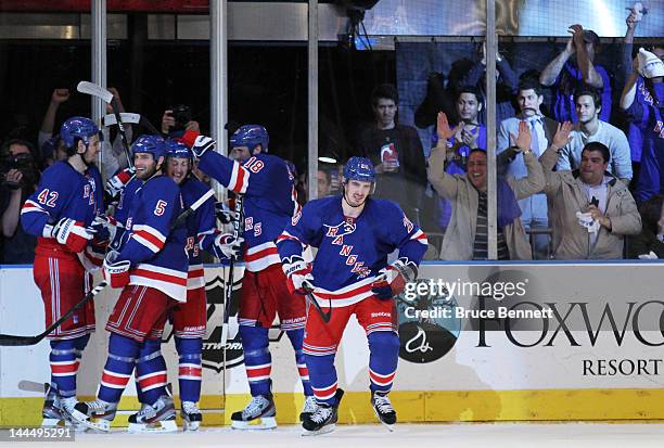 Chris Kreider of the New York Rangers celebrates his third period goal with teammates in Game One of the Eastern Conference Final against the New...