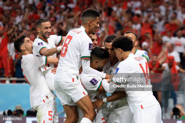 Abdelhamid Sabiri of Morocco celebrates after scoring their team's first goal with their teammates during the FIFA World Cup Qatar 2022 Group F match...