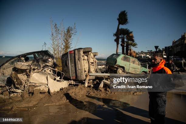 Cars dragged on the Casamicciola beach by the landslide on November 27, 2022 in Casamicciola Terme, Italy. Italian rescuers were searching for a...