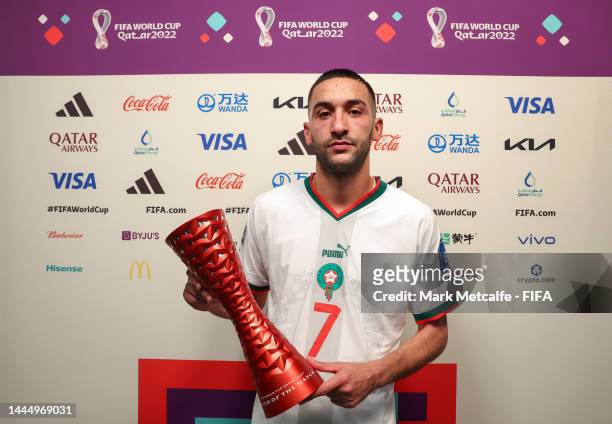 Hakim Ziyech of Morocco poses with the Budweiser Player of The Match trophy following the FIFA World Cup Qatar 2022 Group F match between Belgium and...