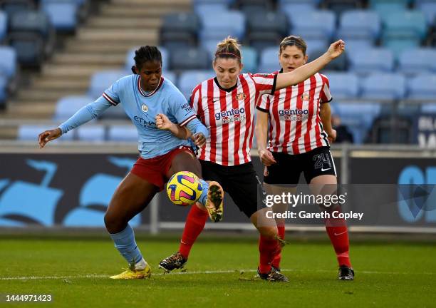 Khadija Shaw of Manchester City Women challenges Grace McCatty of Sunderland Ladies during the FA Women's Continental Tyres League Cup match between...