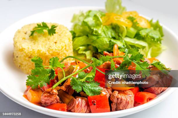 chinese traditional fried rice with shaky beef, vegetables served on a white plate high resolution stock photo - shaky stock pictures, royalty-free photos & images