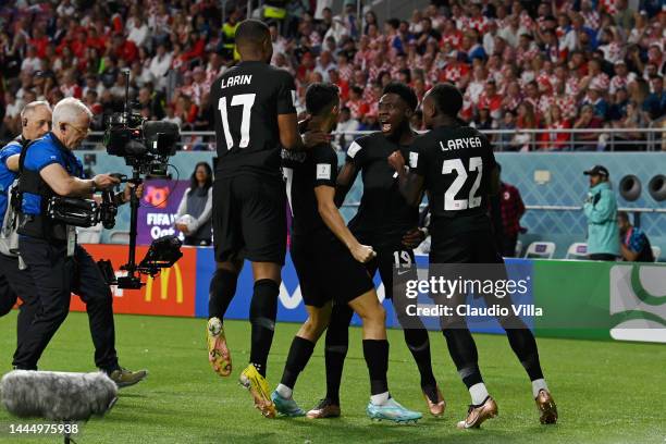 Alphonso Davies of Canada celebrates with teammates after scoring their team's first goal during the FIFA World Cup Qatar 2022 Group F match between...