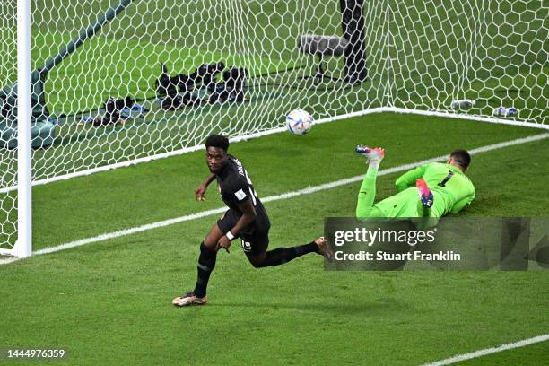 Alphonso Davies of Canada celebrates after scoring their team's first goal during the FIFA World Cup Qatar 2022 Group F match between Croatia and...