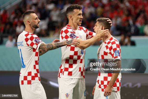 Andrej Kramaric of Croatia celebrates after scoring their team's first goal with their teammates Marcelo Brozovic and Ivan Perisic during the FIFA...