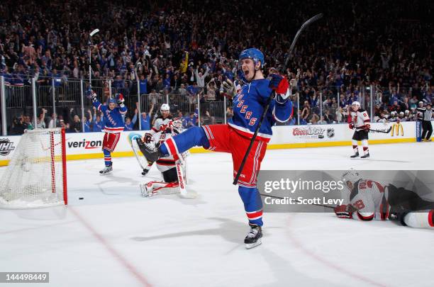 Chris Kreider of the New York Rangers celebrates his third period goal against Martin Brodeur of the New Jersey Devils in Game One of the Eastern...