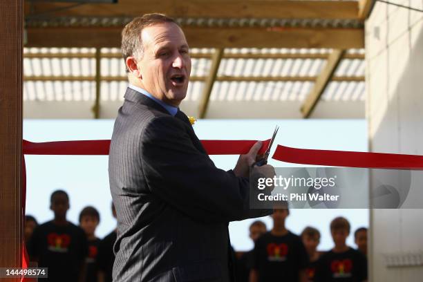 New Zealand Prime Minister John Key cuts the ribbon as he opens a new classroom block at the Westminister Christian School on May 15, 2012 in...