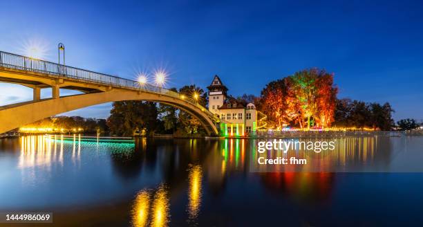 berlin-treptower park with "insel der jugend" (abteiinsel) at blue hour - treptower park stock pictures, royalty-free photos & images